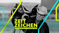 Cowboy mit Sattel über der Schulter und Zigarette im Mund