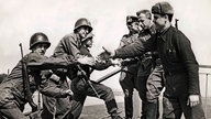 West Meets East On Elbe Bridge Torgau, Germany, April 25, 1945 American troops (left) reach out to grasp hands of soldie