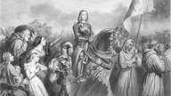 Eine zeitgenössische Darstellung zeigt Jeanne d'Arc in Männerkleidung und zu Pferd