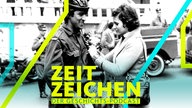 Eine Frau heftet am 25.04.1974 einem Soldaten in Lissabon eine rote Nelke an, das Symbol der portugiesischen Revolution