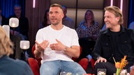 Lukas Podolski und Markus Krampe