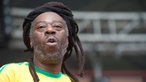  	Spencer „MC Spee“ Graham mit seinem Dreadlock Dutt