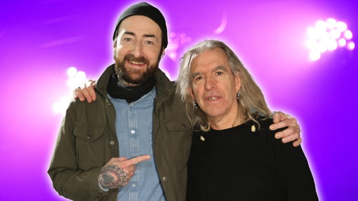 Oliver Plöger trifft Justin Sullivan beim New Modell Army Weihnachtskonzert 2025 in Köln