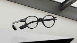 Hörbrille schwebt auf einem Tisch.
