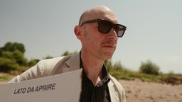 Porträtbild Mann mit Sonnerbrille