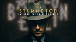 Kommissar Gereon Rath mit schwarzem Hut im Dunklen.