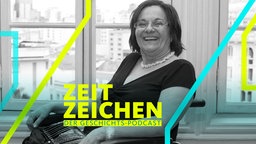 Maria da Penha im Rollstuhl