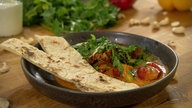 Das Bild zeigt eine Schüssel mit dem Butter Chicken 