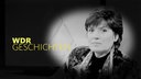 Christine Westermann im Studio in lila Oberteil