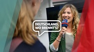 WDR-Reporterin führt ein Interview mit einem Mikrofon in der Hand mit der Schrift "Deutschland, wo brennt's?" 