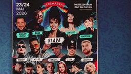 Ein Plakat zeigt verschiedene Personen.