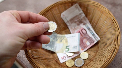 Geld in einer Kollekte