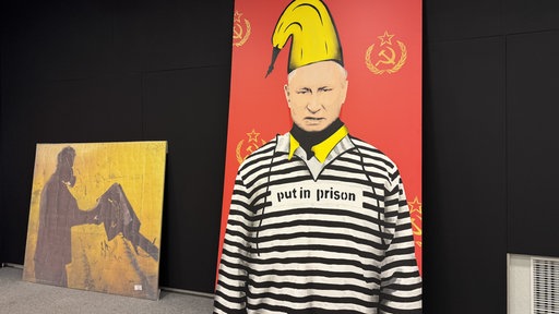 Satirisches Bild zeigt Putin in Sträflingskleidung