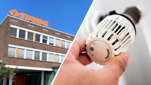 Zu sehen ist eine Hand mit einem Heizungsregler. Links im Bild ein Gebäude der Firma Stawag.