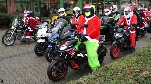 Motorräder und ihre Fahrer