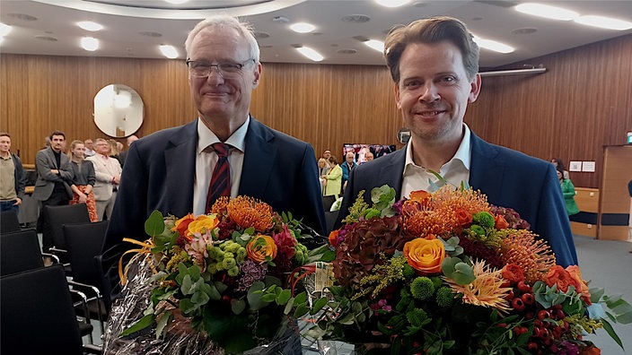 Die Kandidaten im Portrait - rechts Arne von Boetticher (CDU), links Robert Winkels (SPD)