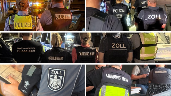 Mehrere Einsatzkräfte von Polizei, Zoll und Bezirksregierung sind von Hinten zu sehen. 