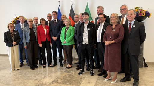 Ordensträger und Ordensträgerinnen mit Hendrik Wüst