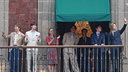 Members of K-pop band BTS greet fans from a balcony of the National Palace alongside Mexican President Claudia Sheinbaum, in Mexico City