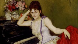 Porträt, auf dem Pianistin und Komponistin Sophie Menter im Kleid vor einem prachtvollen Blumenstrauß (1846-1918) sich auf ein Klavier stützt. Gefunden in der Sammlung der Staatlichen Tretjakow-Galerie, Moskau. Das Aufnahmedatum ist nicht bekannt.