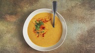 Bild einer Kürbissuppe, Aussehen kann vom Rezept abweichen. 