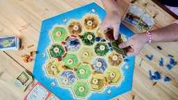 Brettspiel "Catan" in einem Café in Kopenhagen