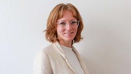Nina Locher lächelt in die Kamera. 