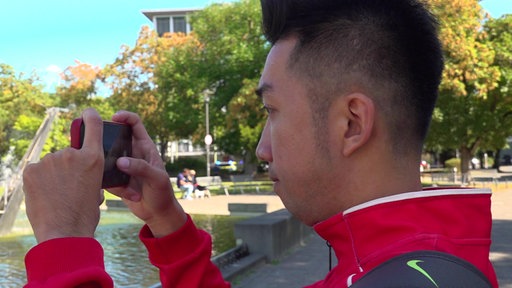 Trotz Reisestress und Müdigkeit nutzt Ho Phuoc Sang die Zeit zum Sightseeing.