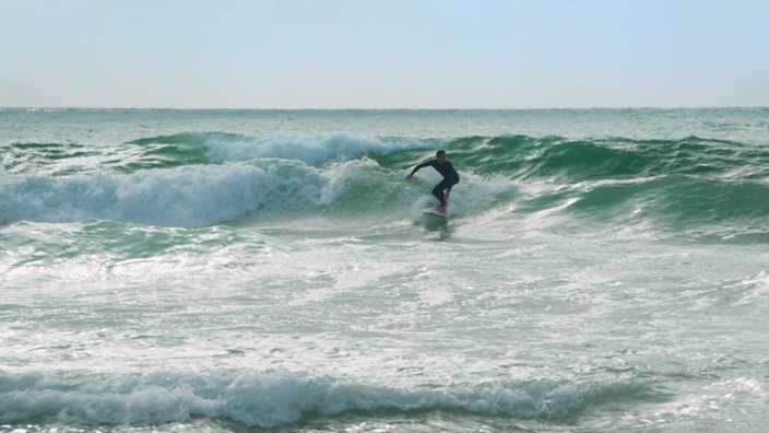 Surfer auf den Wellen