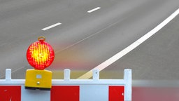 Bildmontage Sperrung einer Straße